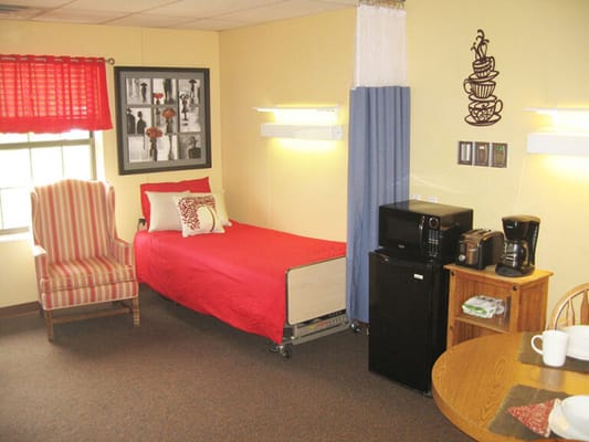 Private resident room with bed and amenities