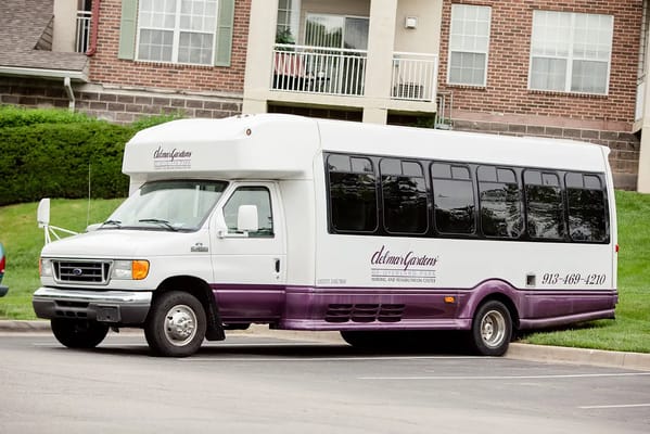 Facility transport shuttle parked outside