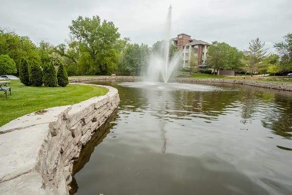 Outdoor fountain in a landscaped area of the facility