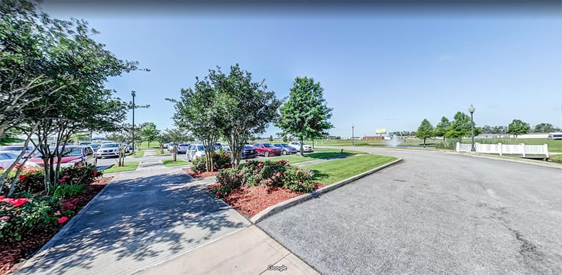 Pathway and landscaped area outside the facility