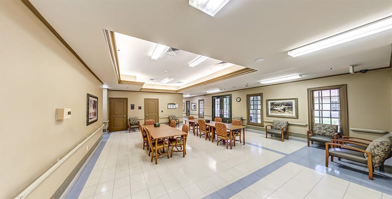 Interior view of a dining area with tables and chairs