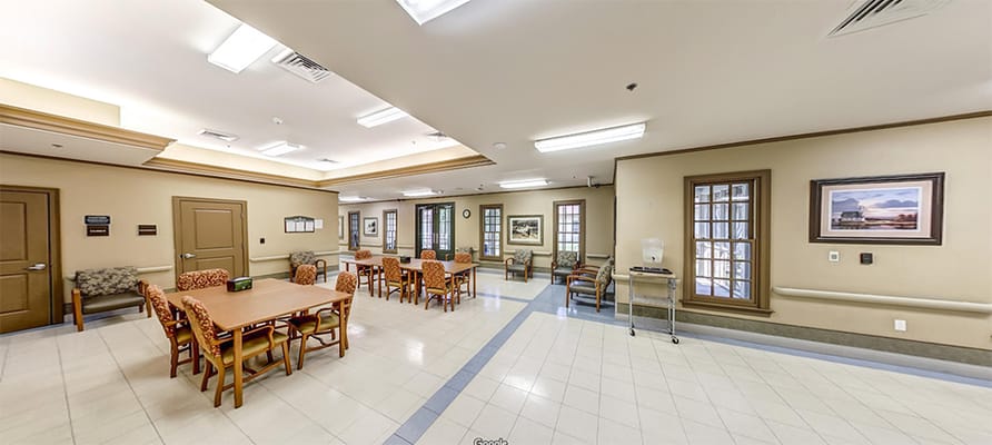 Bright common area with tables and chairs