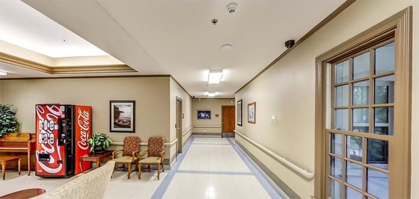 Interior hallway with seating and a vending machine