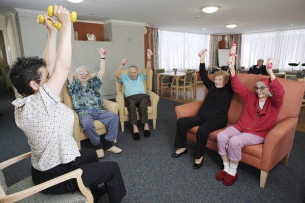 Residents participating in a group exercise activity