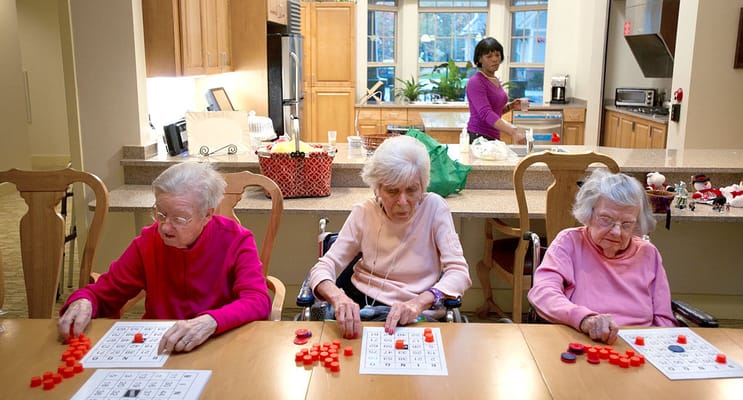 Residents playing bingo in an activity room