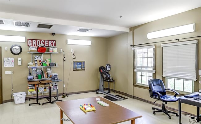 Interior view of an activity room with shelves and exercise equipment