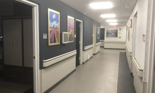 View of a hallway with artwork on the walls