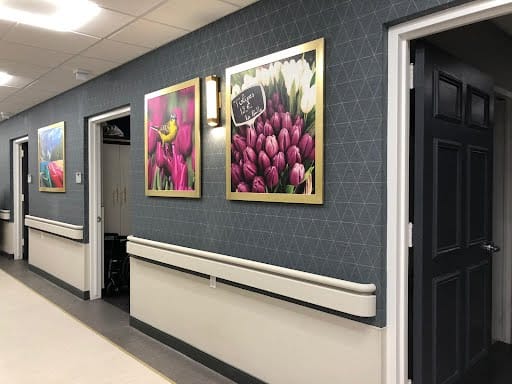 Brightly decorated hallway with floral artwork