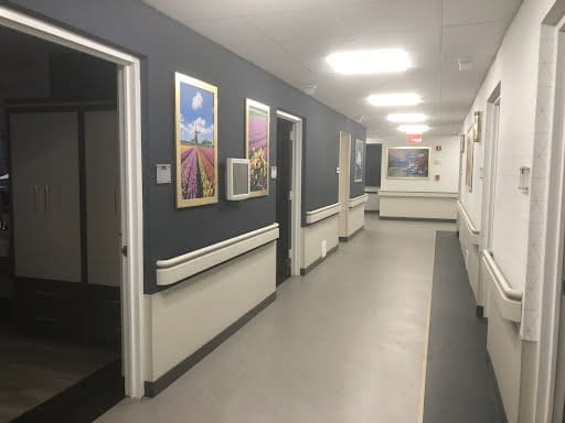 Bright interior hallway with artwork on the walls
