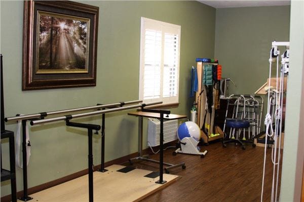 Therapy space with equipment and artwork on the wall