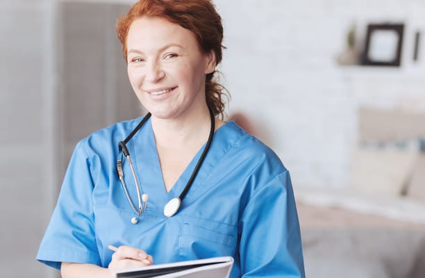 Nurse smiling in a care facility setting