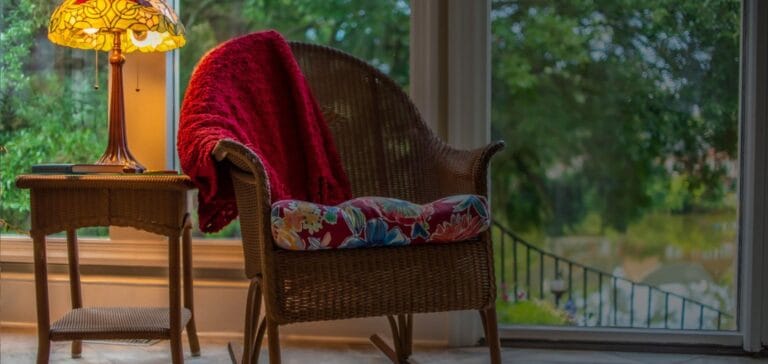 Cozy armchair with a lamp in a well-lit interior space