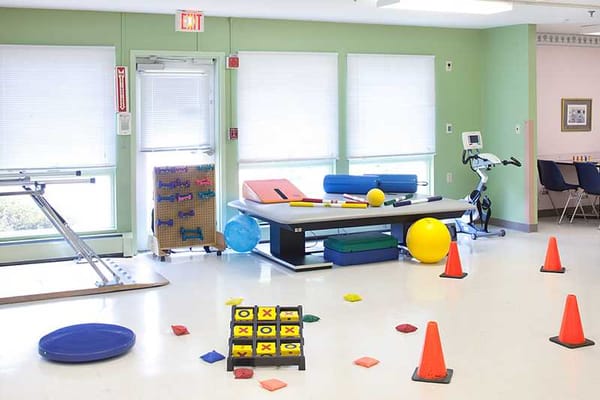 Interior activity space with exercise equipment and colorful props