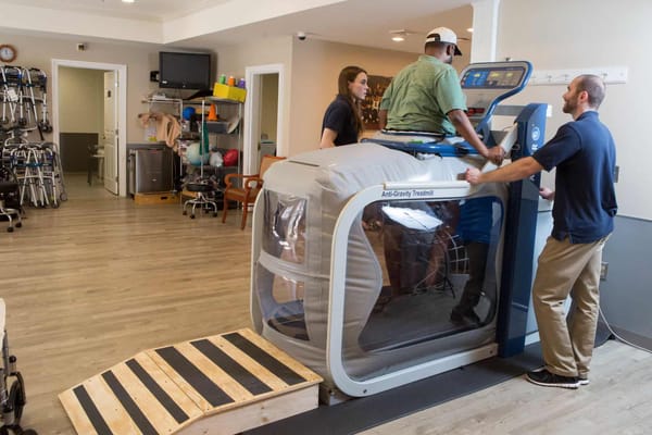 Assisted rehabilitation therapy session in a facility