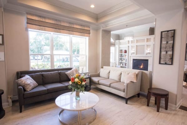 Cozy common area with seating and a bouquet of flowers