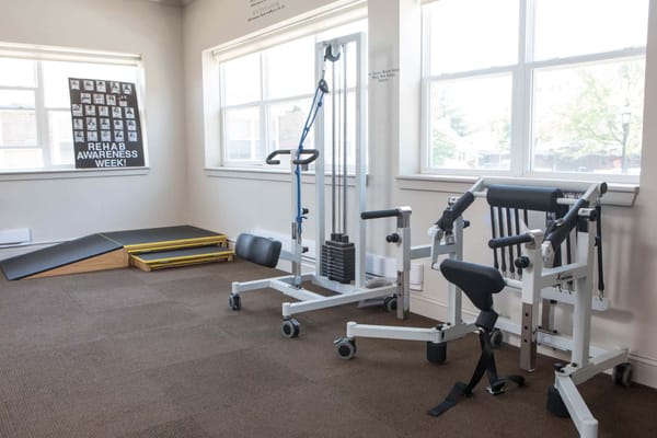 Interior view of a rehabilitation area with exercise equipment