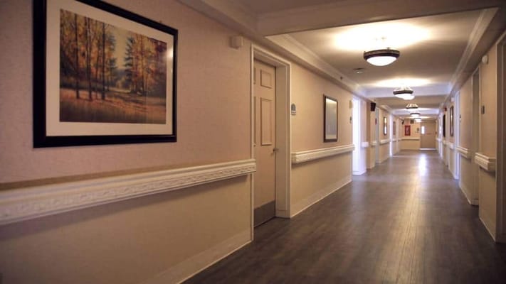 Interior corridor featuring artwork on the walls