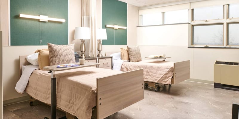 A comfortable shared bedroom in a senior care facility