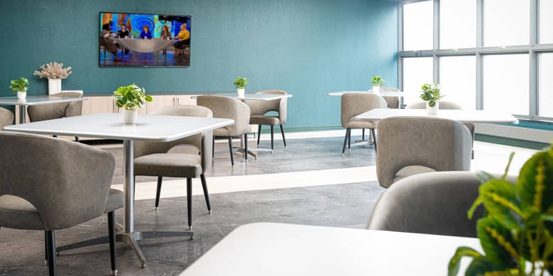 Bright dining area with tables and chairs