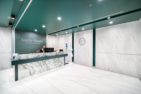 Reception area with a modern design and staff member at desk