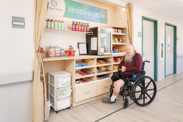 A resident store with a man in a wheelchair