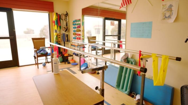 Physical therapy room with exercise equipment