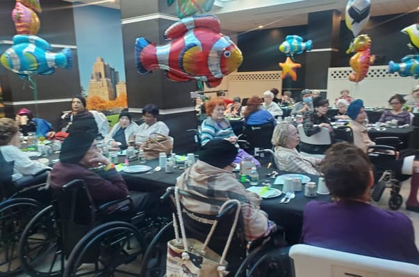 Residents enjoying a festive dining event with decorations