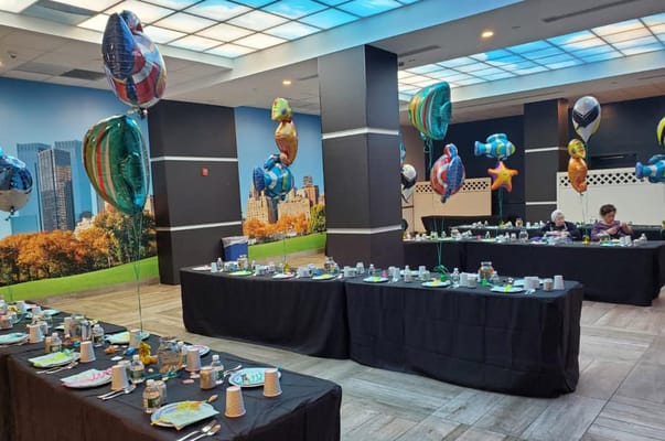 Decorated activity room with balloons for a celebration