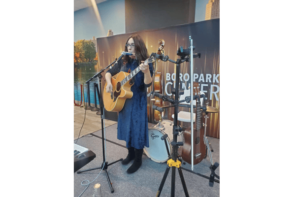 Musician performing at a community event