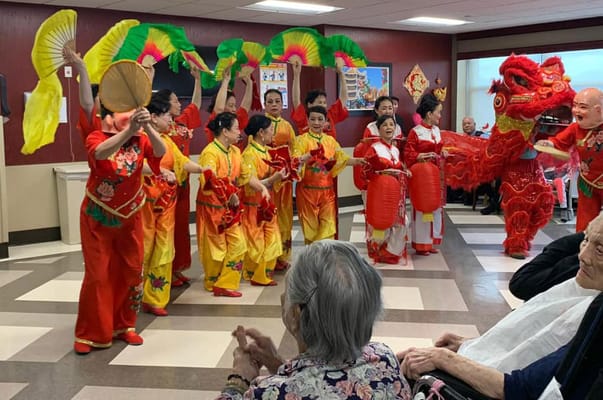 Residents enjoying a performance in a common area