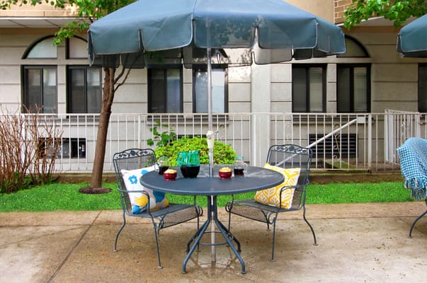 Outdoor seating area with umbrellas and chairs
