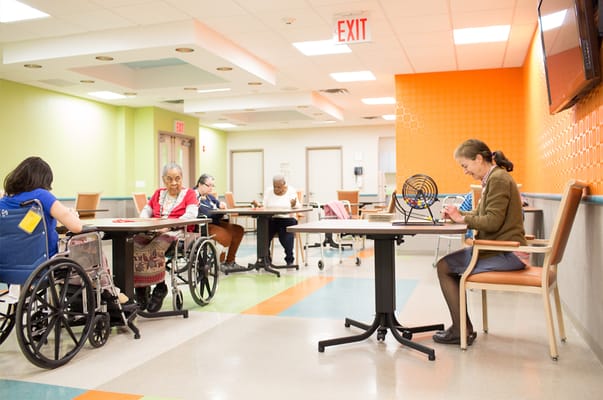 Residents engaged in an activity in a bright common area