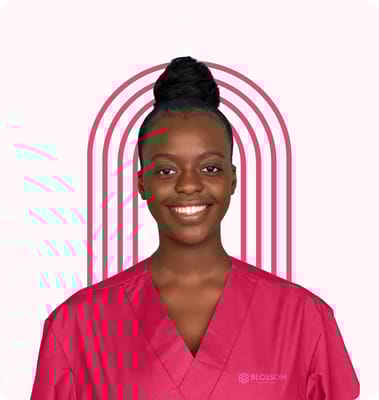 Staff member in a pink scrubs with a smile