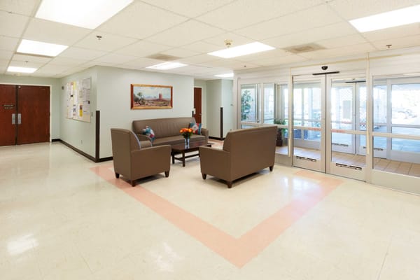 A common area with seating and bright lighting