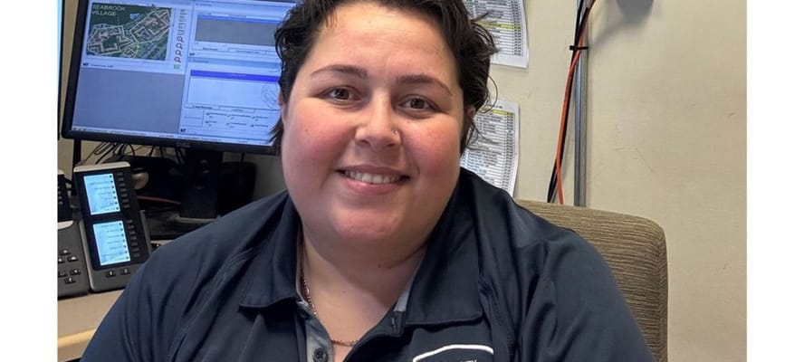 Staff member posing in an office setting