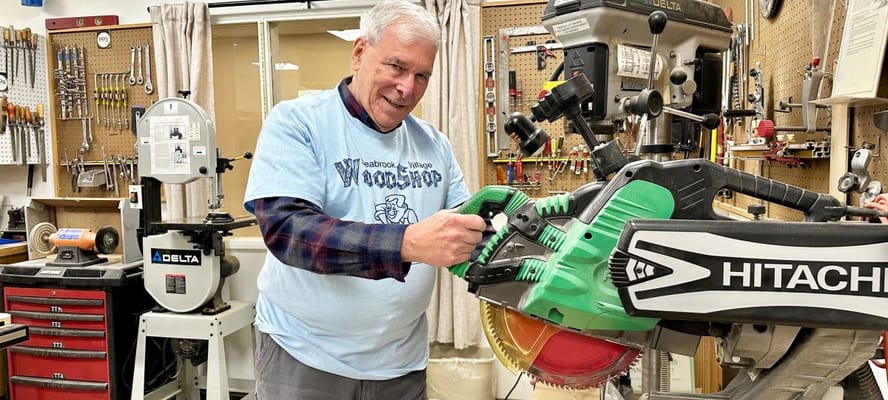 A resident working in a woodworking shop
