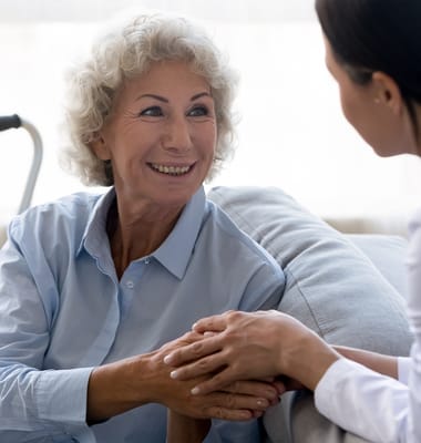 Resident and staff member sharing a warm moment