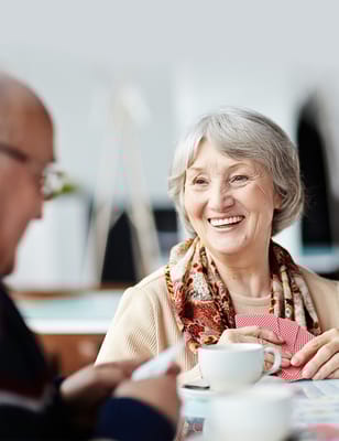 Senior woman enjoying tea with a smile