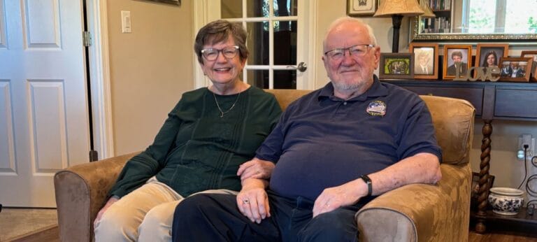 A couple sitting together in a cozy living room