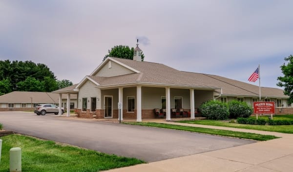 Exterior view of a senior care facility with garden