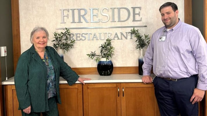 Resident and staff member at the Fireside Restaurant