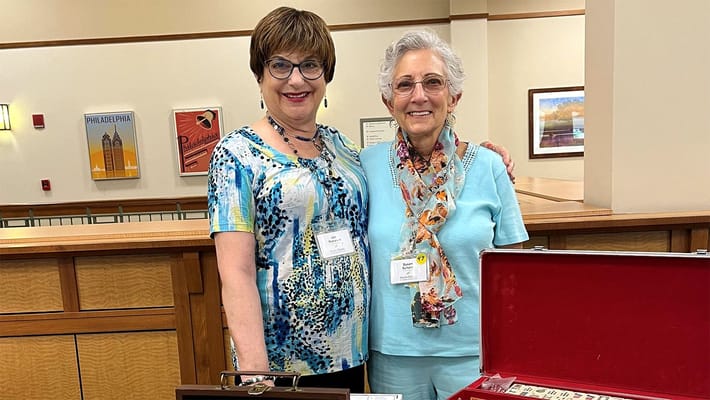 Two residents enjoying an indoor activity together