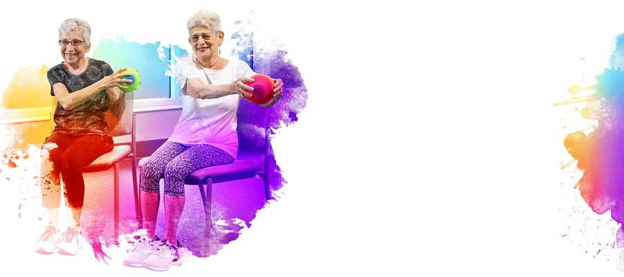 Two seniors exercising with colorful weights in a bright room
