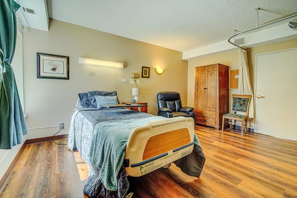 Private resident room with bed and furnishings