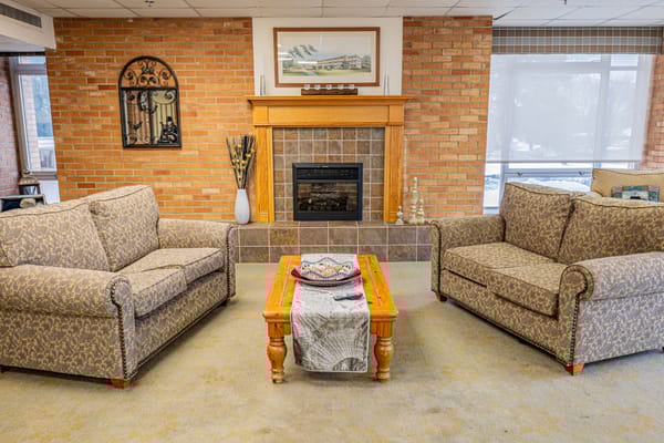 Cozy common area with comfortable seating and fireplace