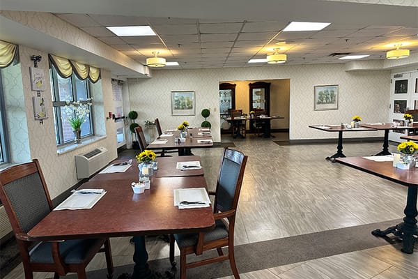 Dining area with tables set for residents