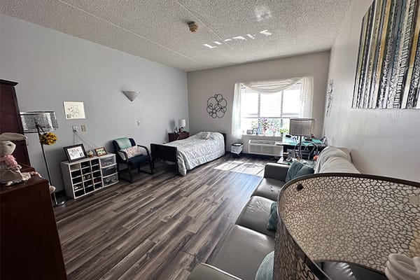 Bright and spacious resident room with a cozy setup