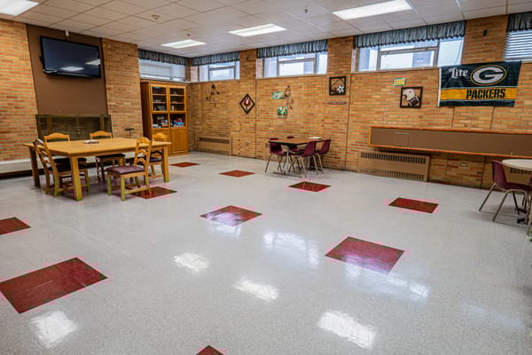 Bright common area with tables and chairs