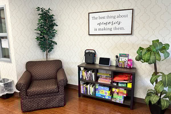 Cozy lounge area with books and a chair