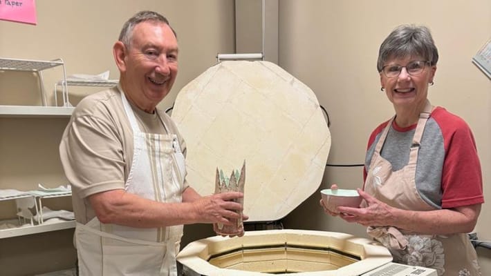 Residents engaging in pottery activity in the studio